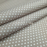Tessuto Cotone H 140 cm - CUORICINI FONDO TORTORA