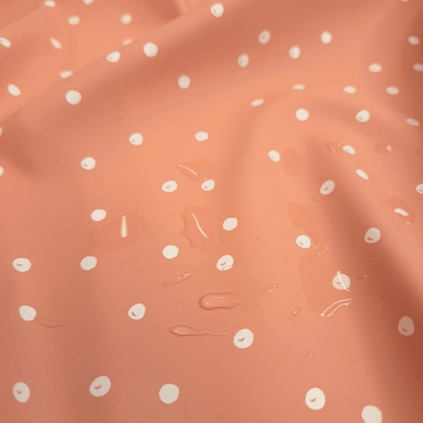 Tessuto Impermeabile H 145 cm - POIS SALMONE