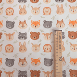 Tessuto Cotone "Collezione Baby Wonderland" H 145 cm - ANIMAL FACE/FOGLIOLINE