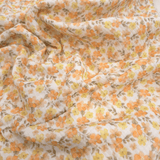 Mussola di Cotone Doppia Garza H 140 cm - FIORELLINI ARANCIO E GIALLI/LATTE