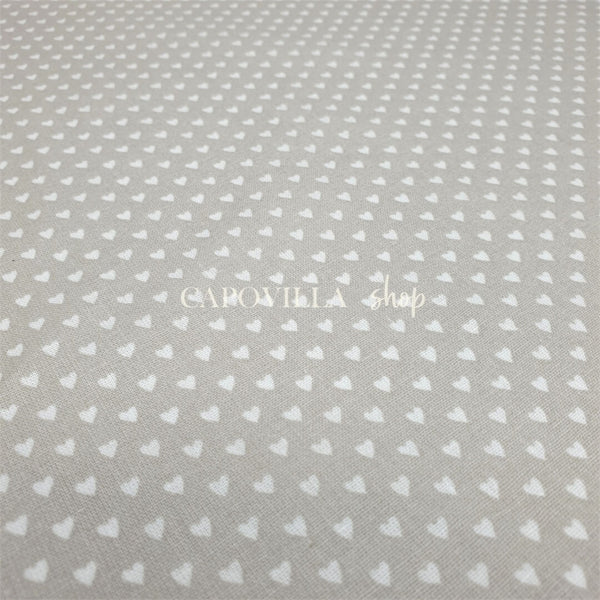 Tessuto Cotone H 140 cm - CUORICINI FONDO BEIGE
